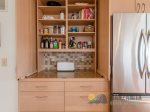 Inside this cabinet is a fully loaded-pantry for all your needs.